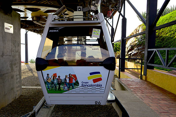 Chicamocha, Colombia - January 14, 2014: A cable car in the Chicamocha National Park leaves the Cable Car station, to cross the Chicamocha canyon; It has a capacity of 8 persons and is almost full.